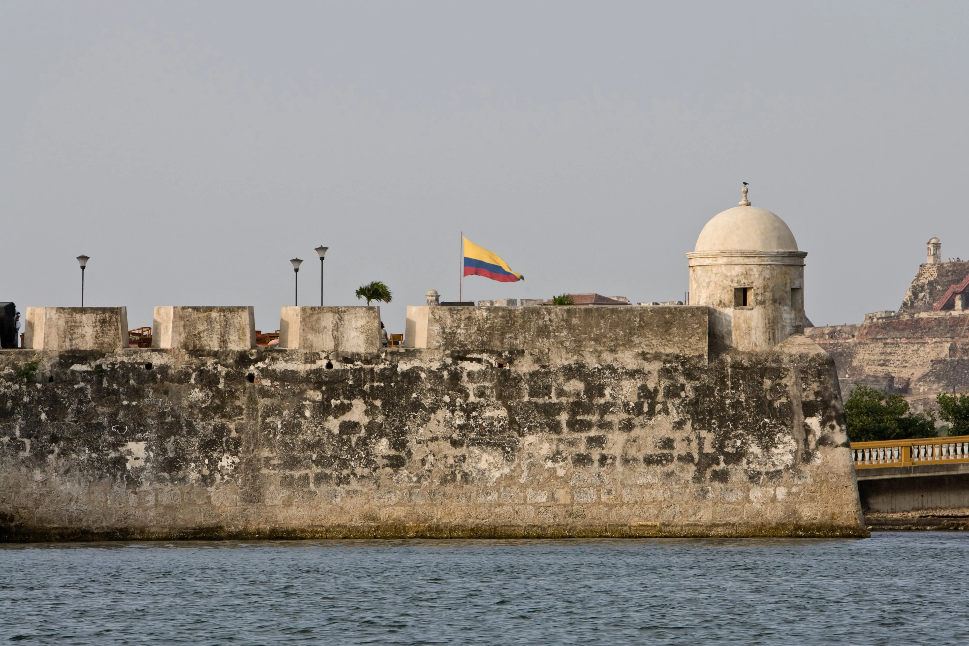 Rooftops, church domes, and colonial facades of Cartagena's walled Old City under a bright Caribbean sky
