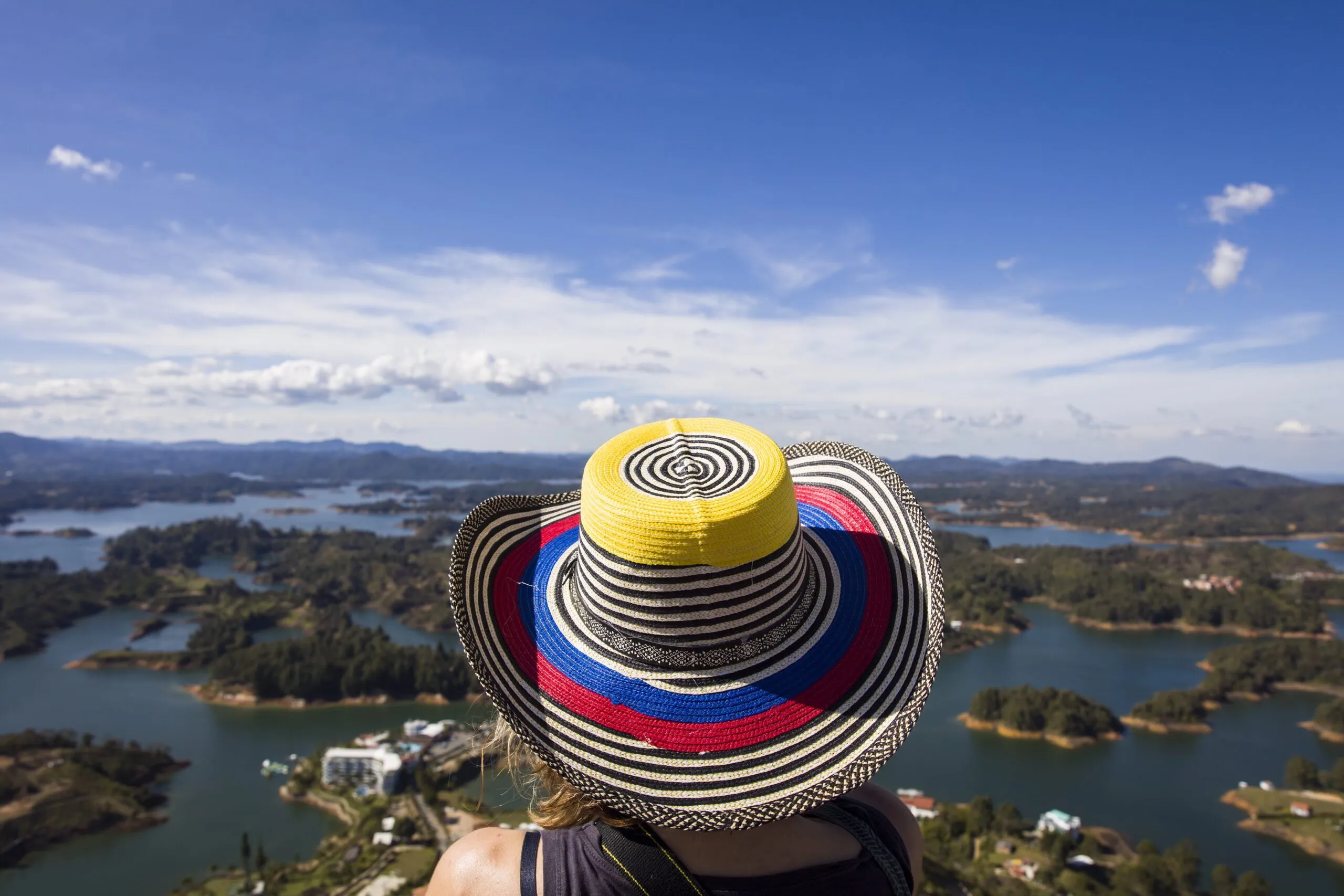 Traveller in a traditional Colombian hat overlooking the Guatapé lakes